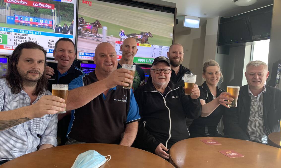 Members of the William Farrer Hotel SPC, including David Barnhill (back, middle), toast their chances in The Kosciuszko early this week. For the third time, they'll be selecting an emergency. Picture: Jon Tuxworth