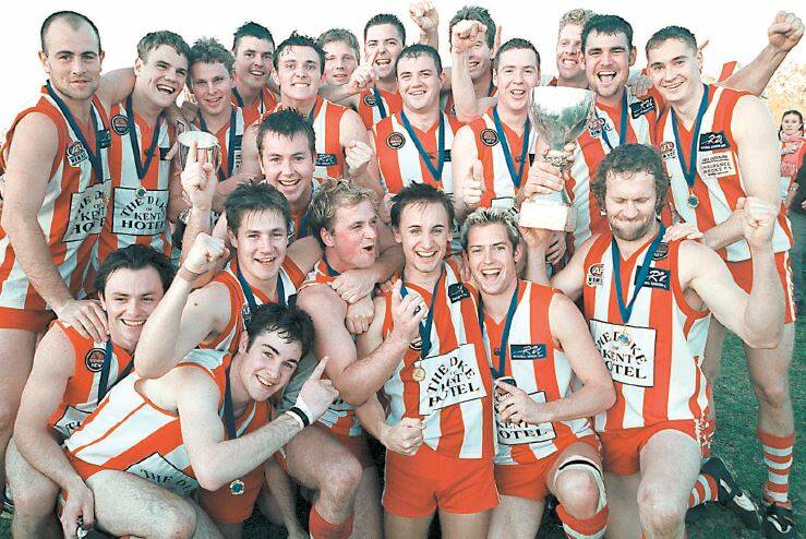 FAIRYTALE FINISH: From wooden spooners to Farrer League premiers, Rivcoll players celebrate their last success.