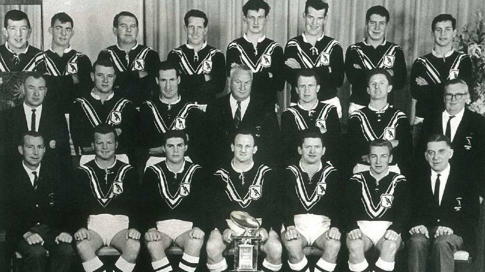 SUMMONS' 1966 PREMIERS, WAGGA MAGPIES: (Back, from left) Cyril Wild, Kevin Brown, Ken Cluff, William Rake, Michael Walker, William Hickford, John Mavroudis; (centre) trainer John Knowles, Ron Wright, Tom McDonell, selector Tom Hilton, Robert Wallace, Barry Cottam, treasurer Paddy O'Brien; (front) selector Ernie Lloyd, Fred Norden, Terry Gaffney, captain-coach Arthur Summons, Robert Honeysett, Garry Wheeler, president Keith Inglis.