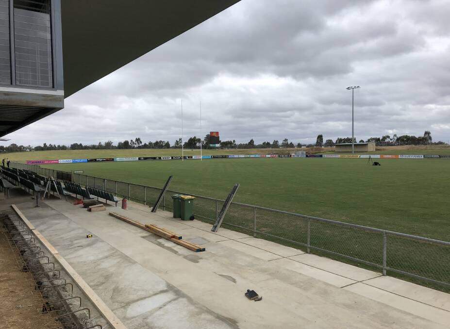 The concrete has been poured for the extra seats at the southern end of the ground. On the far side, the canteens will be relocated higher up the hill. The ground will have a capacity of 10,300 for the NRL game in May. Picture: Peter Doherty