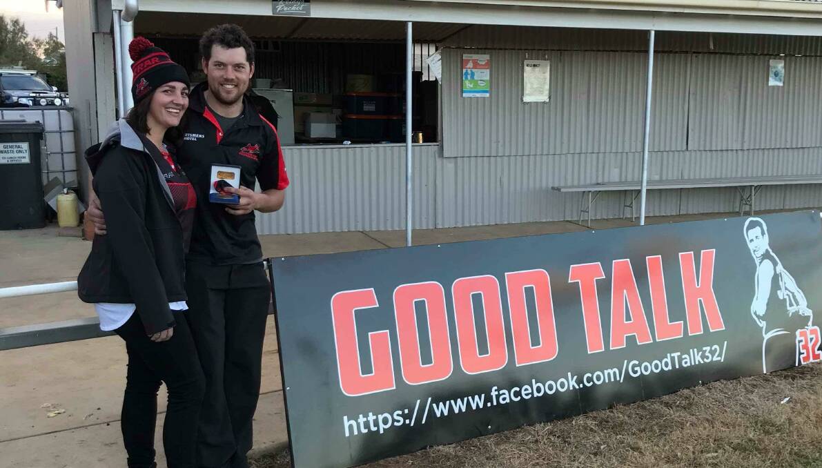 Fran Reid presents Marrar's Brad Moye with the Graeme Reid Medal for best on ground in the annual 'Good Talk' game against Coleambally. 