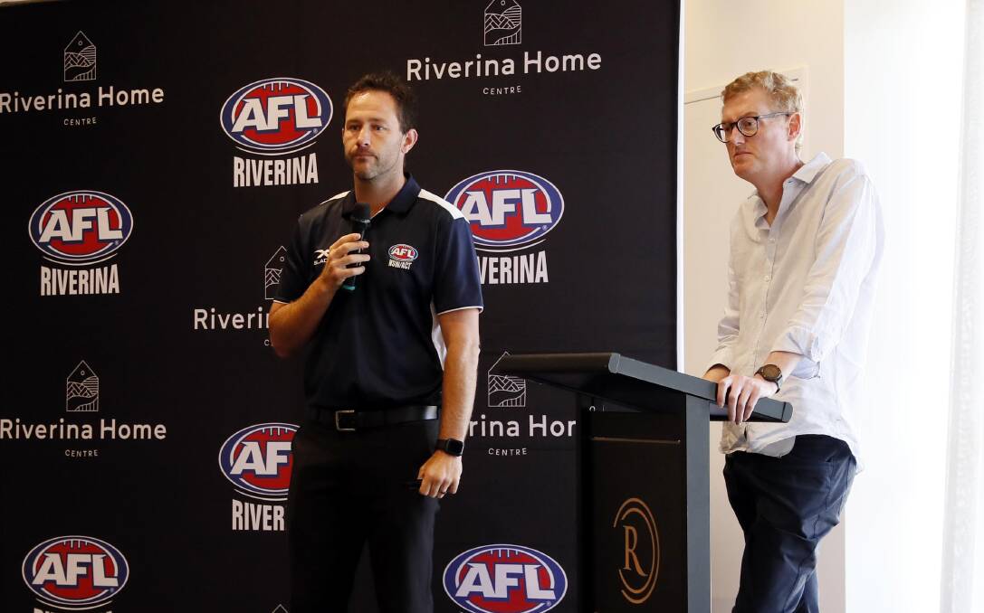 LISTENING: AFL's regional manager for NSW Marc Geppert (left) with AFL Riverina chairman Michael Irons at last week's leagues announcement.