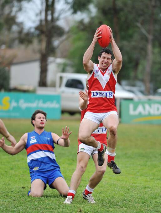 GOOD CATCH: Midfielder Curtis Allen, pictured playing for Collingullie-Ashmont-Kapooka in 2013, is a potential mid-season signing for Marrar. 