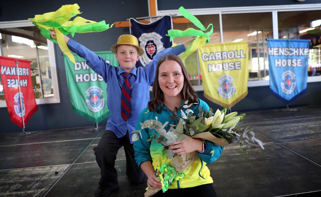 WARM WELCOME: Angus Grant, 8, was among the Sacred Heart Primary School students welcoming Carly Salmon back to school on Friday. Picture: Les Smith