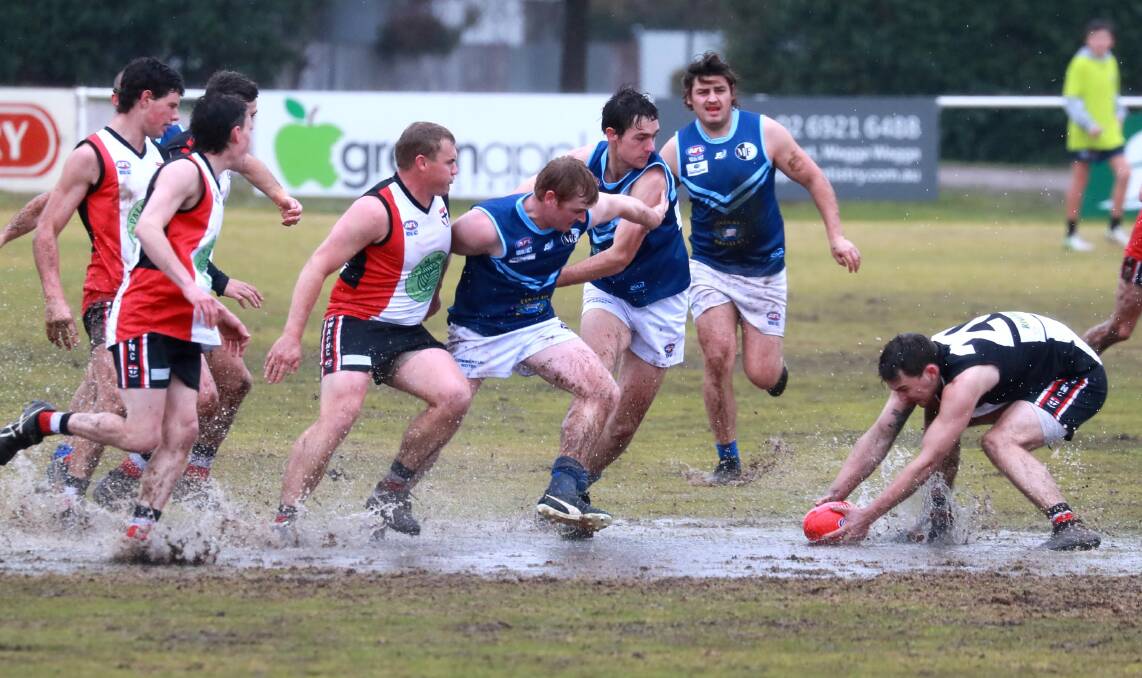 WET WEATHER FOOTY: North Wagga were too strong for Barellan at a waterlogged McPherson Oval on Saturday. Picture: Les Smith