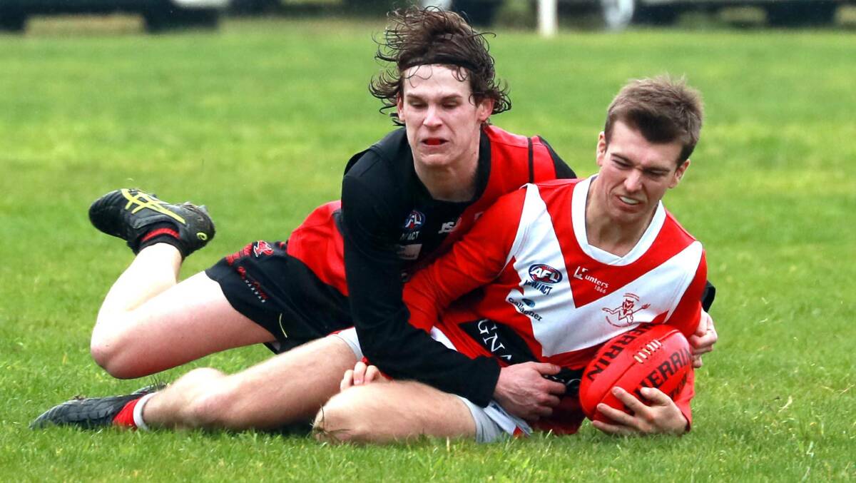 Toby Lawler brings down Harrison Hugler in Marrar's pre-season win against Collingullie-Glenfield Park in July. Gardner had the coaching role for the match. 
