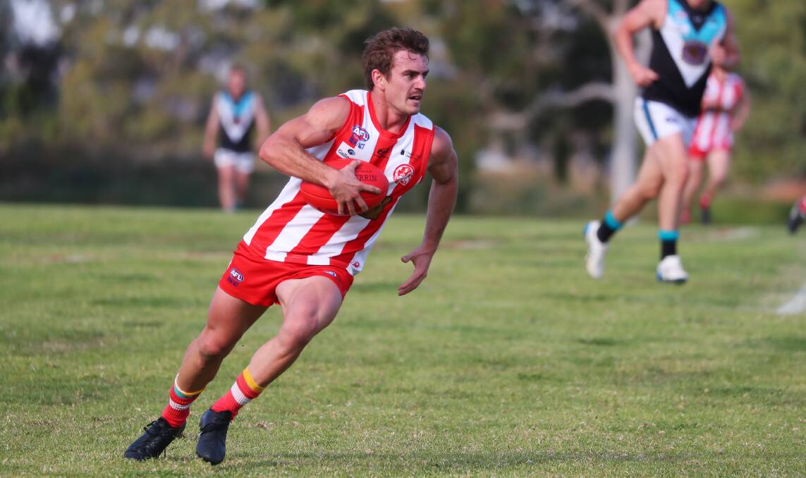 Bushpigs best-and-fairest Lachy Moore powering into action in their win against the Northern Jets. The gun midfielder's brilliant and consistent season was recognised with another major award. Picture: Les Smith