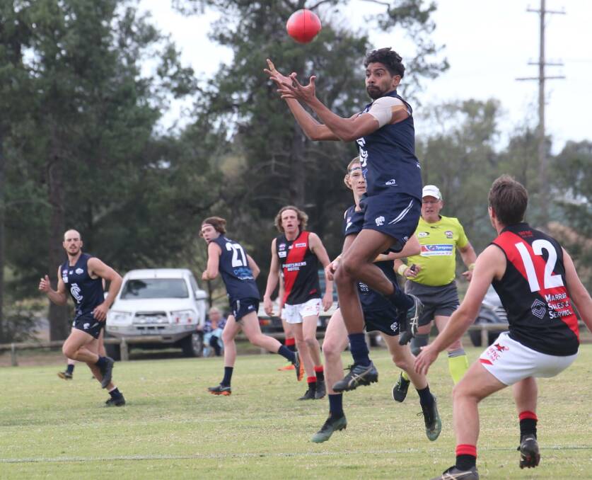 IN FLIGHT: Charlie McAdam goes up for a mark in Coleambally's upset win against Marrar earlier this year. The Blues tackle ladder-leaders North Wagga on Saturday. Picture: Anthony Stipo