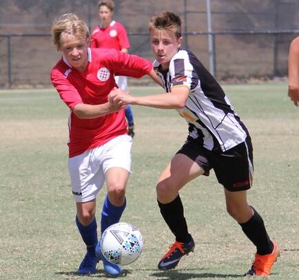 COMPETITIVE START: Conrad Eyles (right) in action for Wagga City Wanderers Under 16 side in their opening round 2-2 draw against Canberra FC. 