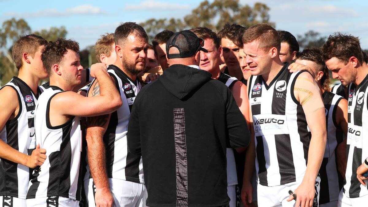 LESSONS LEARNT: The Rock-Yerong Creek players listen up to co-coach Brad Aiken after a tight first quarter at Langtry Oval. Picture: Emma Hillier