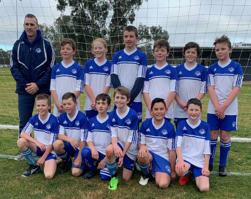SET FOR FINALS: Tolland Wolves under 12s team with coach Will Silver. They'll carry the club's hopes into finals after the long weekend.