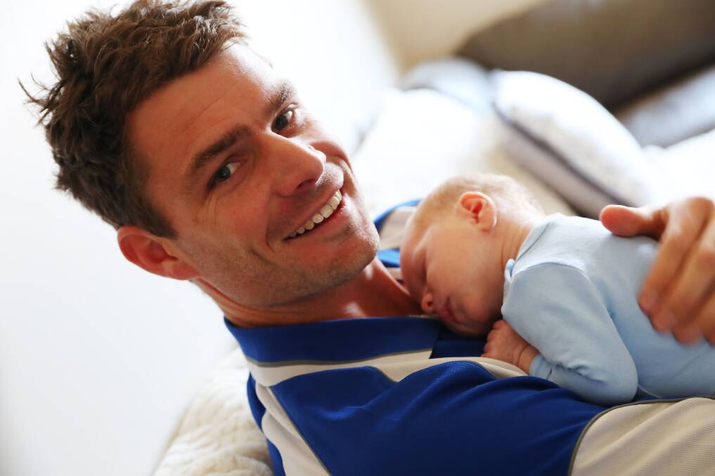 NEW DAD: Temora assistant coach Luke Gerhard at home with three-week-old son, Harry on Friday, ahead of the sudden-death semi-final against Marrar on Father's Day. Picture: Emma Hillier