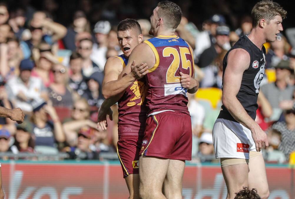 FUTURE UNCERTAIN: Temora's Jake Barrett celebrates a goal 
for the Brisbane Lions this year. Barrett was delisted by the
Lions but still hopes to keep his AFL dream alive. Picture: AAP