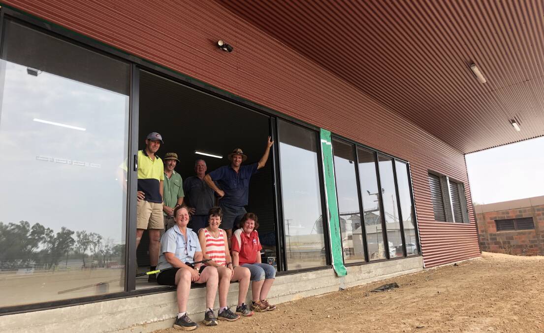 WORKING BEE: (back row) Pete Willis, Terry Langtry, Barry Langtry, David Fox, (front) Cathie Fox, Vicki Langtry and Fiona Willis take a break during Marrar's working bee on Sunday at their new clubrooms.