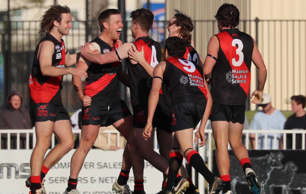 FULL-TIME CELEBRATION: Despite plenty of departures, the Bombers retain a core of players with grand final experience and a culture of success, including leaders Jackson Sanbrook, Josh Hagar (captain), Cal Gardner (assistant coach), Zach Walgers, Brad Moye (9) and Tyler Cunningham (3). 