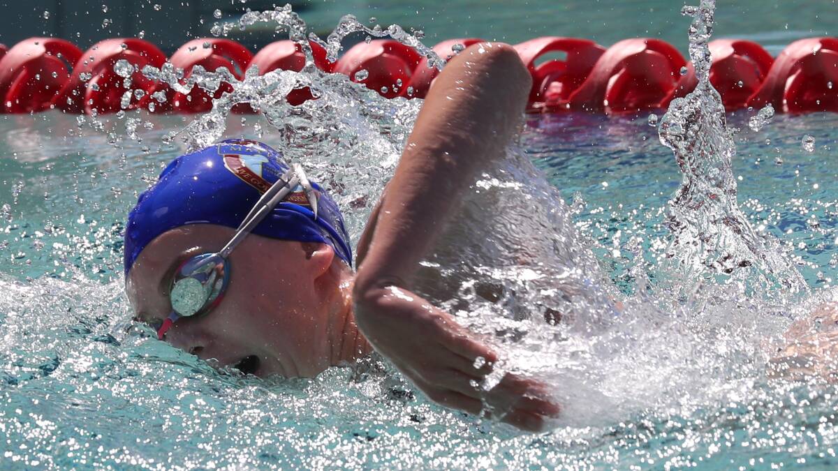 POETRY IN MOTION: Gabrielle Shaw, 16, from Mater Dei Catholic College stretches out in the 50m freestyle during the BISSA swimming carnival on Thursday. Picture: Les Smith