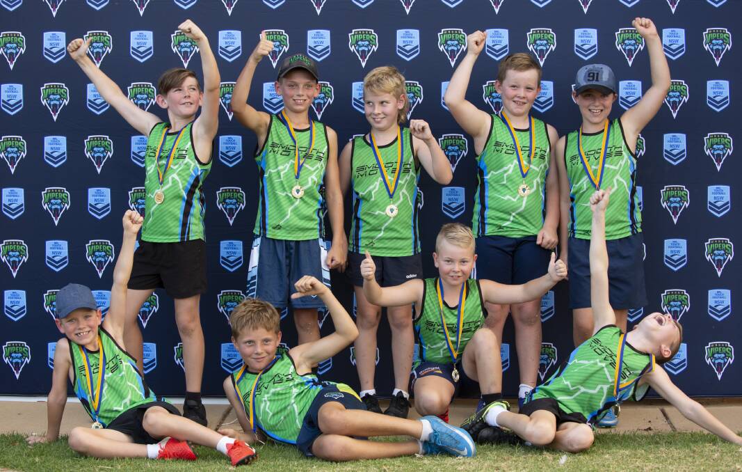 WINNERS ARE GRINNERS: Smooth Moves by name and smooth moves in celebration after winning their under 10 boys grand final at Jubilee Park on Thursday night. Picture: Madeline Begley
