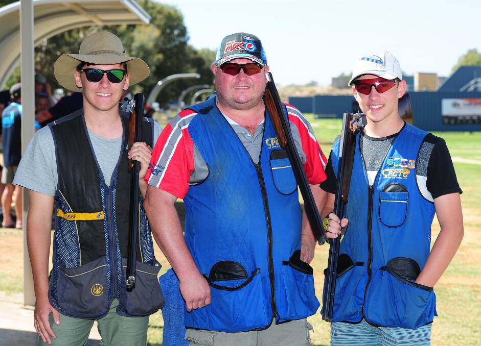FATHER AND SONS: Sydney's Vince Forner is flanked by his boys, Cameron, 16 (left), and Jack, 15, at the National Trap Championships in Wagga on Wednesday. Picture: Kieren L Tilly