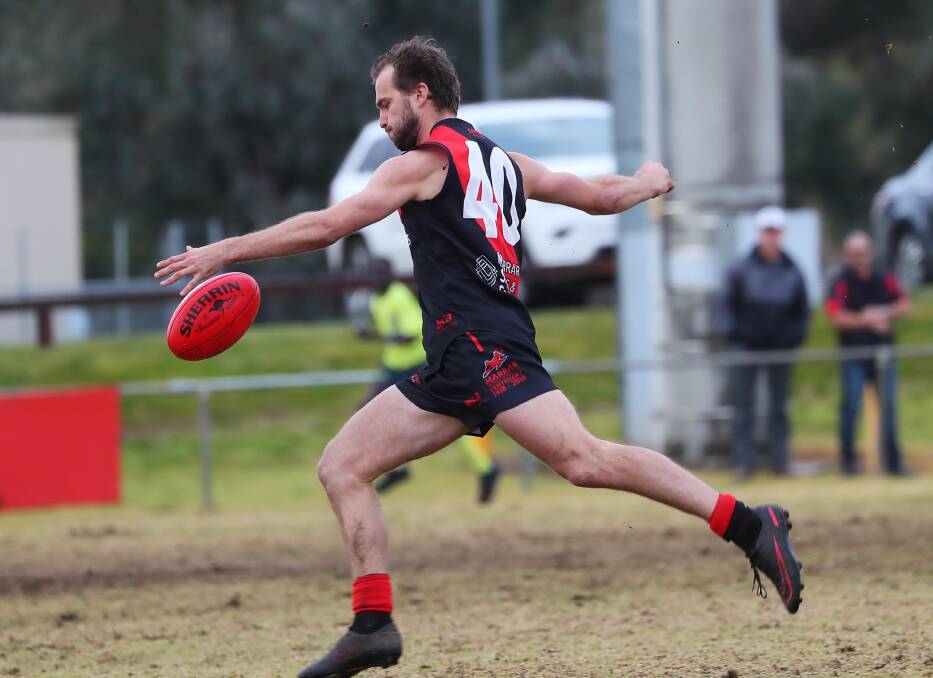 Jake Hindmarsh takes a kick during Marrar's preliminary final win against North Wagga. A week later he kicked a goal in the 12-point grand final victory. 