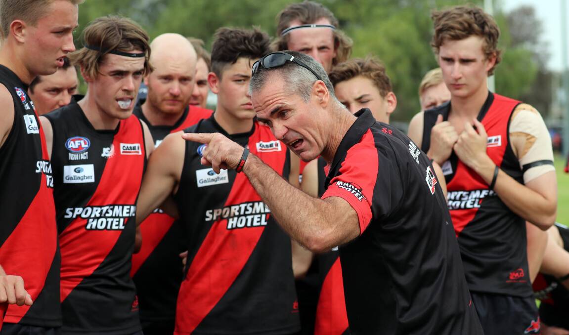 PUMPED: Marrar coach Shane Lenon addresses his team in their first game last season, when a vastly-inexperienced team showed great promise against North Wagga. It was on of only two losses in the regular season for the Bombers.