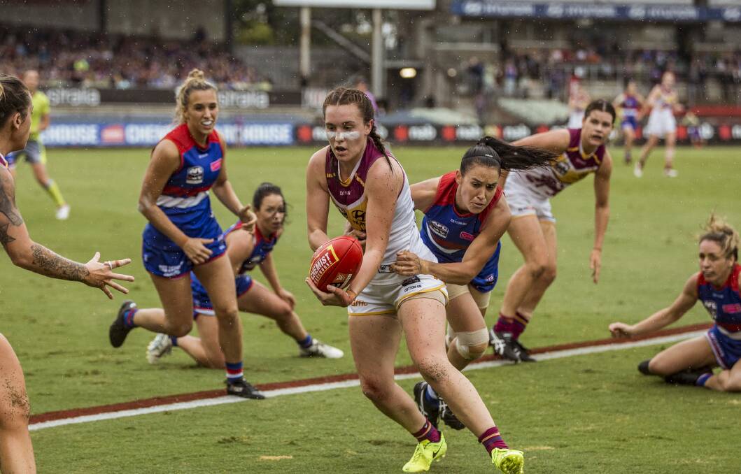 EXPLORING OPTIONS: Brisbane Lions' Arianna Clarke gets a handball away against the Western Bulldogs during the 2018 AFLW Grand Final at Ikon Park, Melbourne. Picture: Chris Hopkins, Fairfax Media