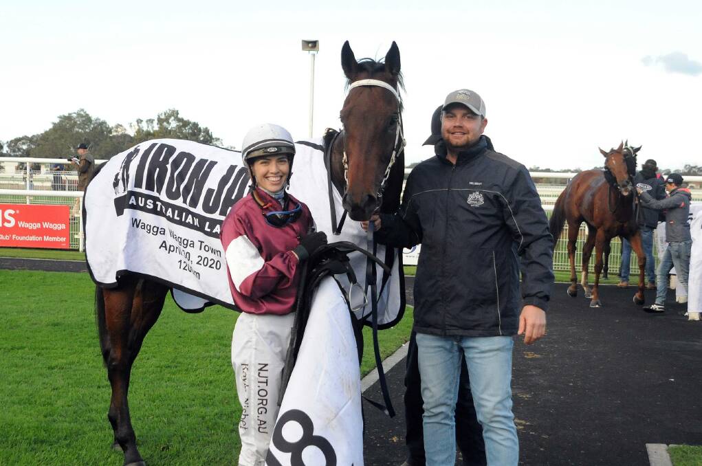 REIGNING CHAMP: Last year's Wagga Town Plate winner, Irish Songs, with jockey Kayla Nisbet and trainer Kurt Goldman. The gelding is among three Goldman nominations for next Thursday's feature. Picture: Trackpix, Kylie Shaw