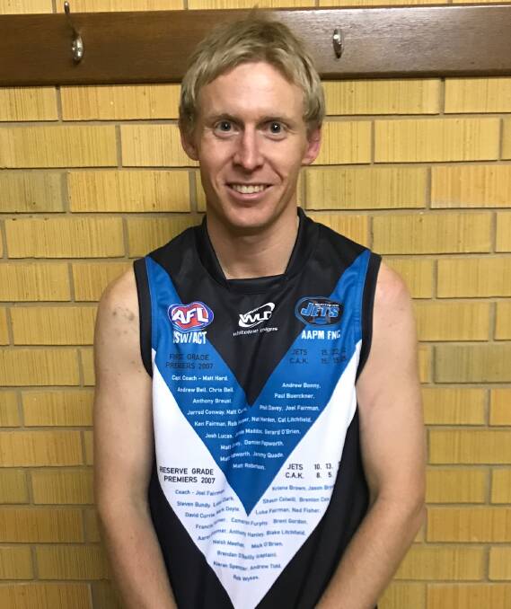 PREMIERSHIP PLAYER: Chris Bell models the special edition jumper. 