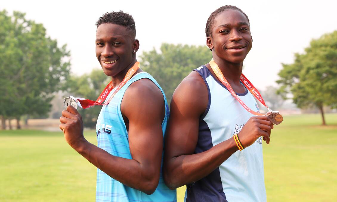 NEW YEAR, NEW CHALLENGES: Godfrey Okerenyang, 17, and brother Gerard, 15, with their medals from the recent Australian All Schools Championships. Picture: Emma Hillier
