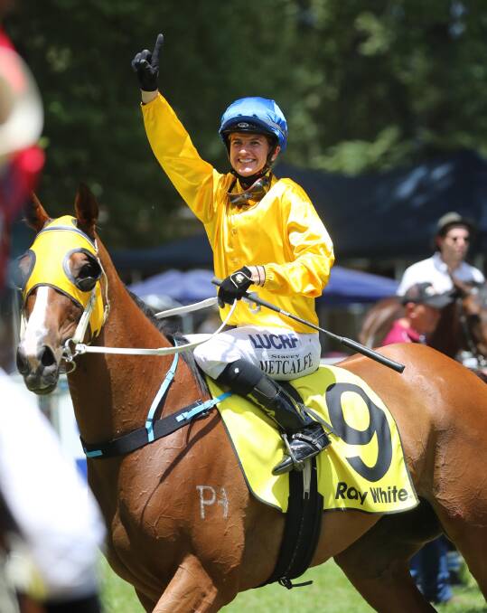 ALL SMILES: Jockey Stacey Metcalfe returns a winner on the Rodger Waters-trained Pastiche after the second race at Tumut's Boxing Day meeting. Picture: Les Smith