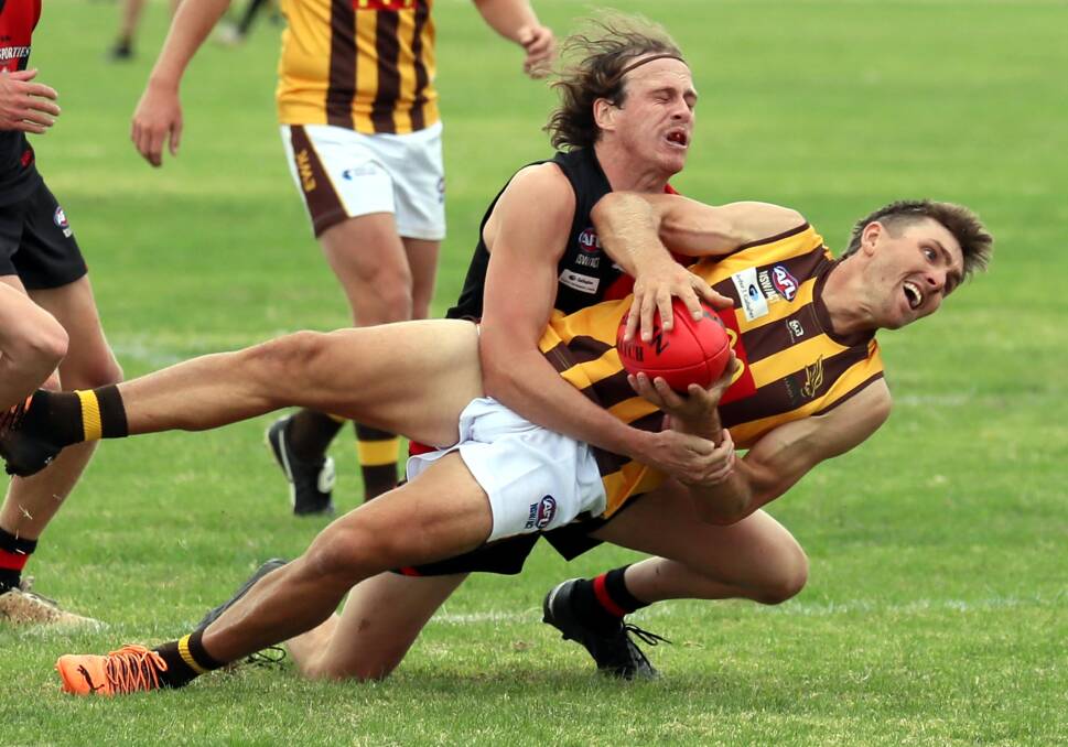 THRILLING ENCOUNTER: Marrar's Jed Jenkins tackles East Wagga Kooringal's Nico Sedgwick who was making his Farrer League debut at Langtry Oval. Picture: Les Smith