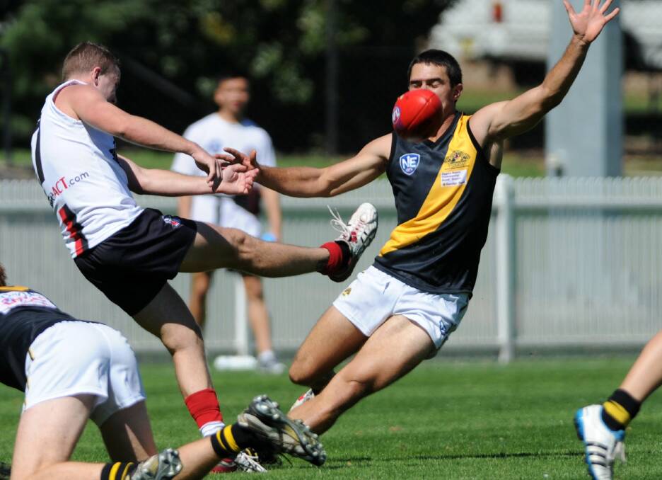 Fred Sleeth (right) playing NEAFL for Labrador against Ainslie in 2012, before he joined Collingullie.