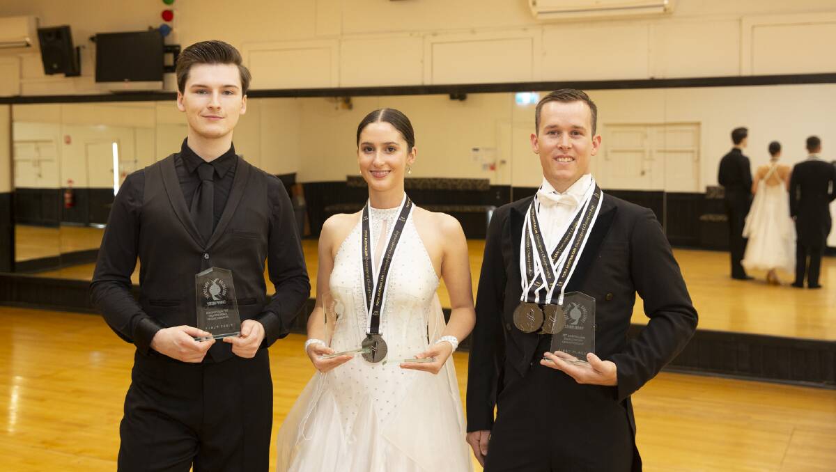 GOLD RUSH: Wagga dancers (from left) Daniel Arnold, Sabrina Donebus and Jason White won four national titles between them at the prestigious Australian DanceSport Championship. Picture: Madeline Begley