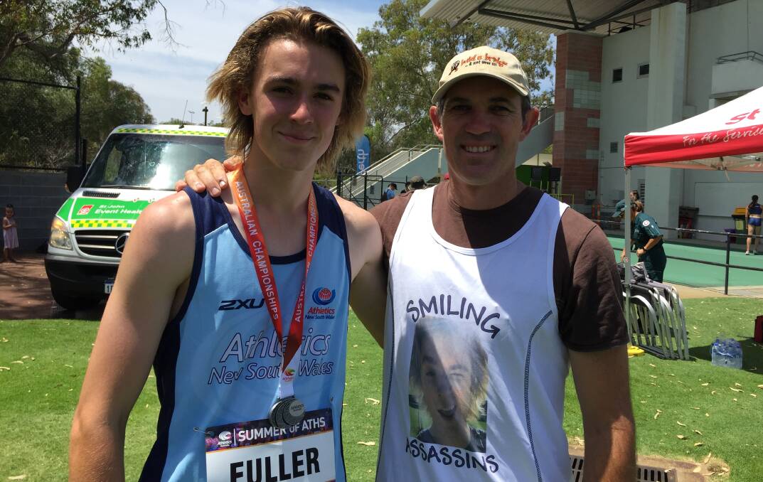 SOMETHING TO SMILE ABOUT: Temora athletics coach Greg Wiencke (right) with jumper George Fuller who was among Wiencke's stable of medallists at Australian All Schools. 