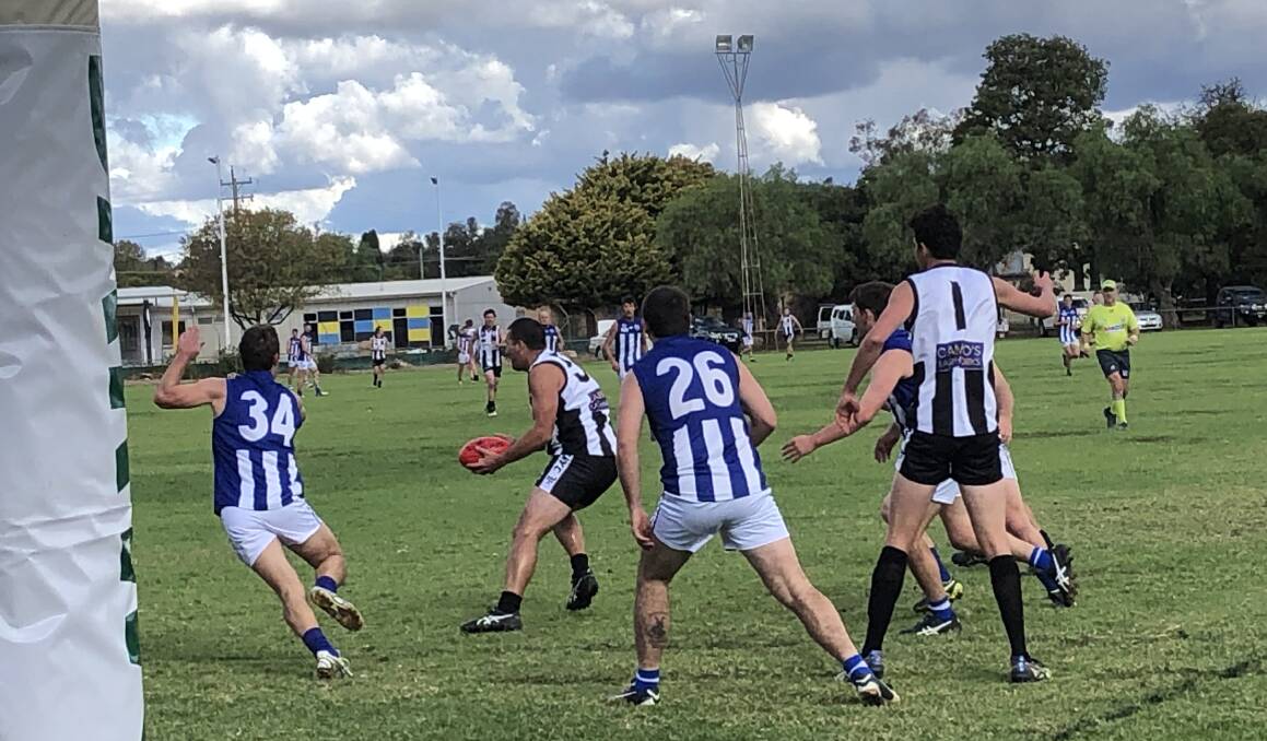 Temora's defence looks to close down the options for TRYC forward Andy Carey in the first quarter. Picture: Peter Doherty