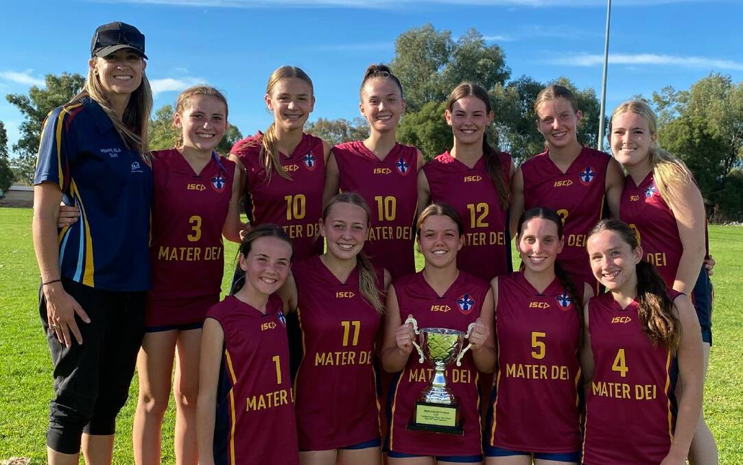 BREAKTHROUGH WIN: Mater Dei Catholic College's successful touch football side after their grand final win against rivals Kildare Catholic College. It was the school's first win in the Preston Butcher Cup.