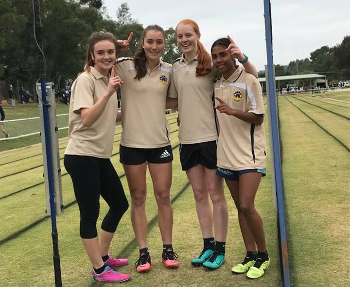 RUNNING INTO HISTORY: Kooringal High's record-breaking relay team (from left) Rhiannon Sevic, Ellen McIntyre, Sophie Crouch and Tarnayar Hinch. 
