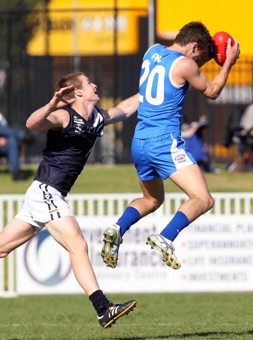 RETURN TO REP: Matt Wallis takes a grab as Farrer League captain in 2015. The Temora forward kicked four goals in the Farrer League's drought-breaking win against Picola League. Picture: Les Smith