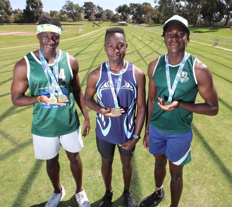 STATE CHAMPS: Godfrey Okerenyang, Kippy Langat and Gerard Okerenyang won gold at NSW All Schools. Picture: Les Smith