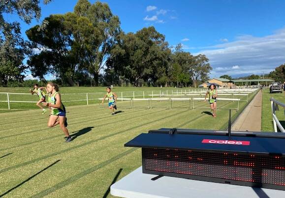 CLOCK-WATCHING: Competitors at Kooringal-Wagga Little Athletics can keep a close eye on their time courtesy of the club's new trackside technology.