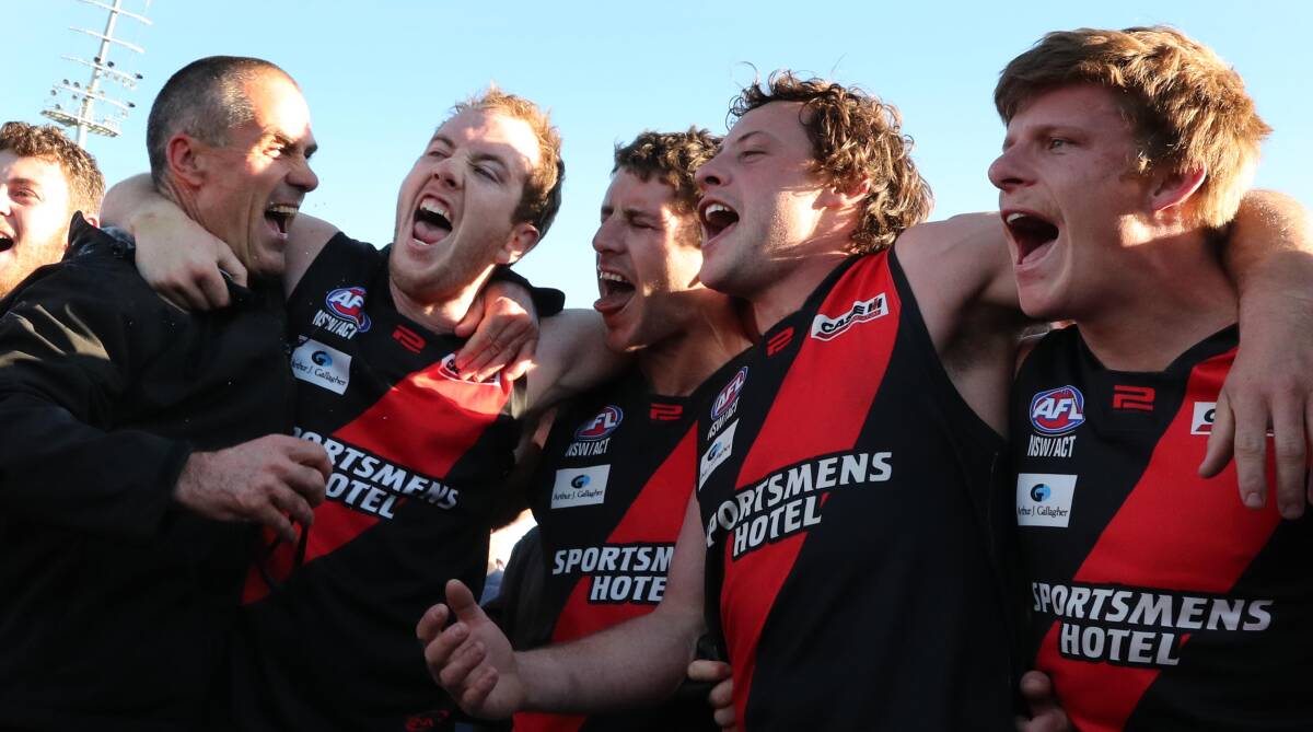 Photographer Les Smith snaps the action as Bombers down Temora in premiership decider.