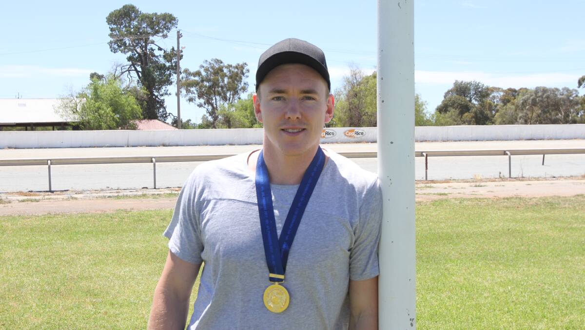 PREMIERSHIP-WINNER: Jacob Townsend back home at Leeton in 2017 with his AFL premiership medal. 