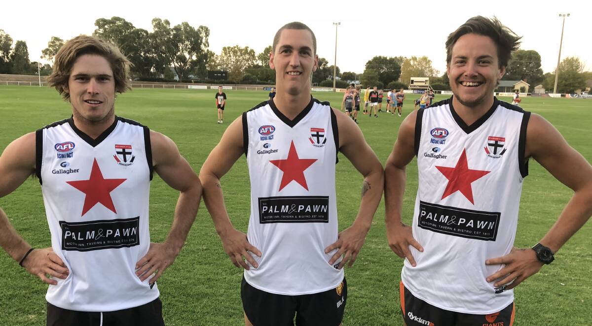 NEW LOOK: (from left) Corey Watt, Troy Curtis and Ben Alexander model the heritage guernsey of the Stars at training on Thursday. North Wagga are set to use the jumpers as an away strip this season. Picture: Peter Doherty