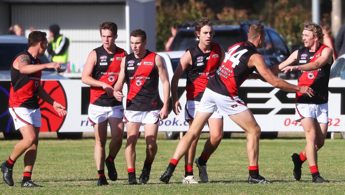 ALL SMILES: Marrar celebrate a first-quarter goal to Zach Walgers (far right), who was among their best in an impressive win against East Wagga-Kooringal at Gumly on Saturday. Picture: Emma Hillier