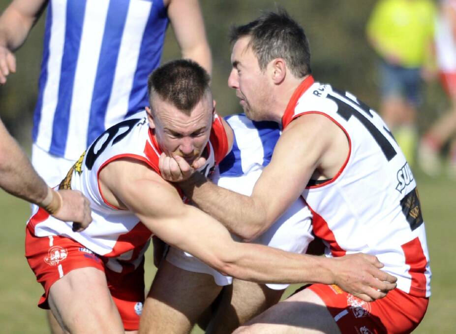 COP THAT: Bushpigs Max Hanrahan and Clay Hamblin sandwich at Temora opponent in CSU's win at Peter Hastie Oval. Picture: Chelsea Sutton