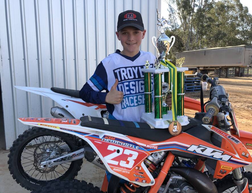 ON TRACK: Wagga's Byron Dennis, 12, with his trophy
and medals after a top-three finish at the national
motocross championships. Picture: Peter Doherty