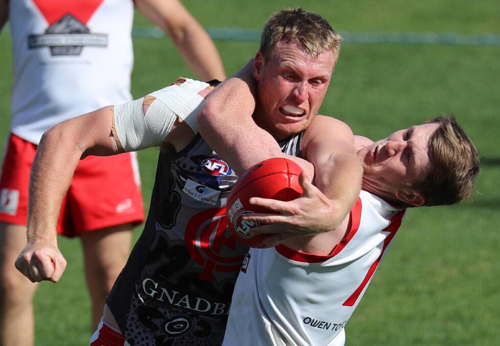 LET'S GO: Collingullie-GP ruckman Ben Klemke and Griffith star Jacob Conlan when the teams met in the second semi-final. 