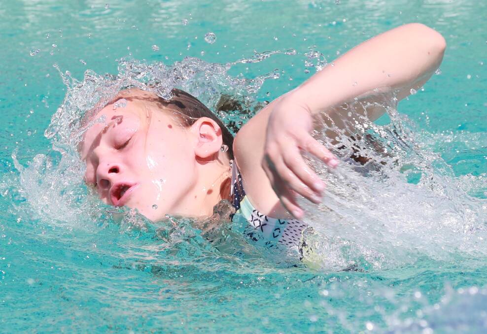 SMOOTH STYLE: Maddie Smith glides through the water in the 11 years girls 25m freestyle at the Kooringal Public School swimming carnival. Picture: Les Smith