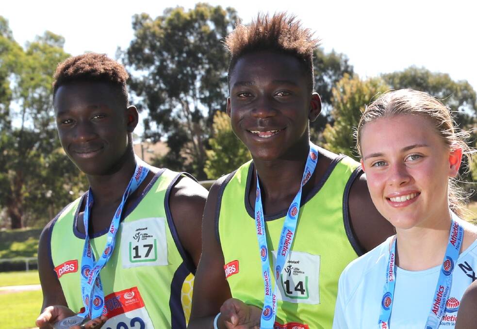 MEDALLISTS: Brothers Godfrey (left) and Gerard Okerenyang and walker Hannah Mison after a previous medal haul. All three added to their career medal collections last weekend at NSW Juniors. 