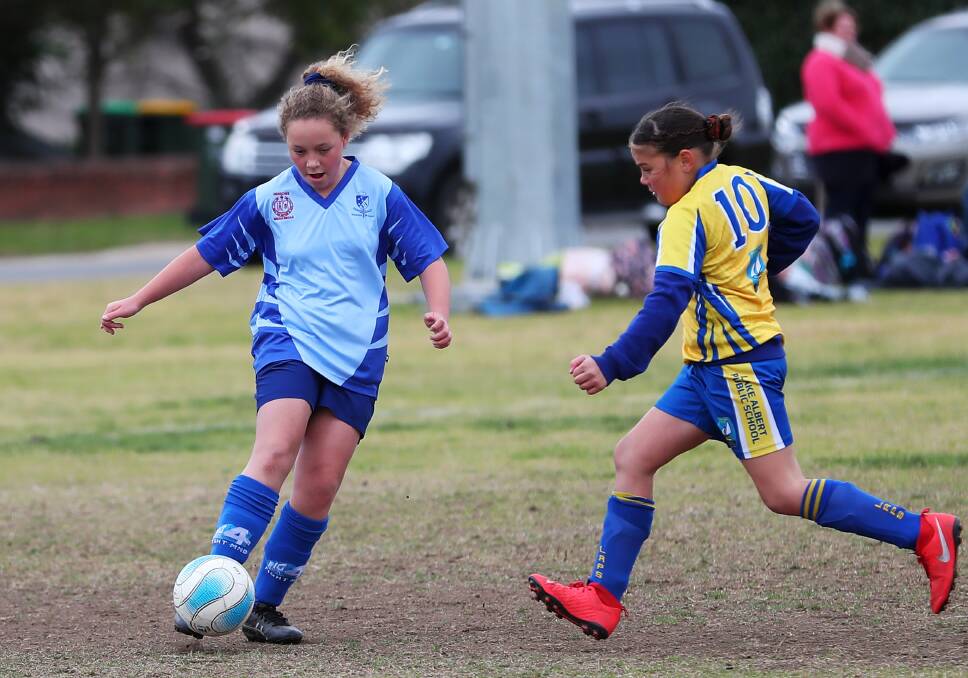 ON THE BALL: Charlie Tooze, 12, in action for Henschke Primary School against Lake Albert Public School in their Sydney FC Cup game on Thursday. Picture: Emma Hillier