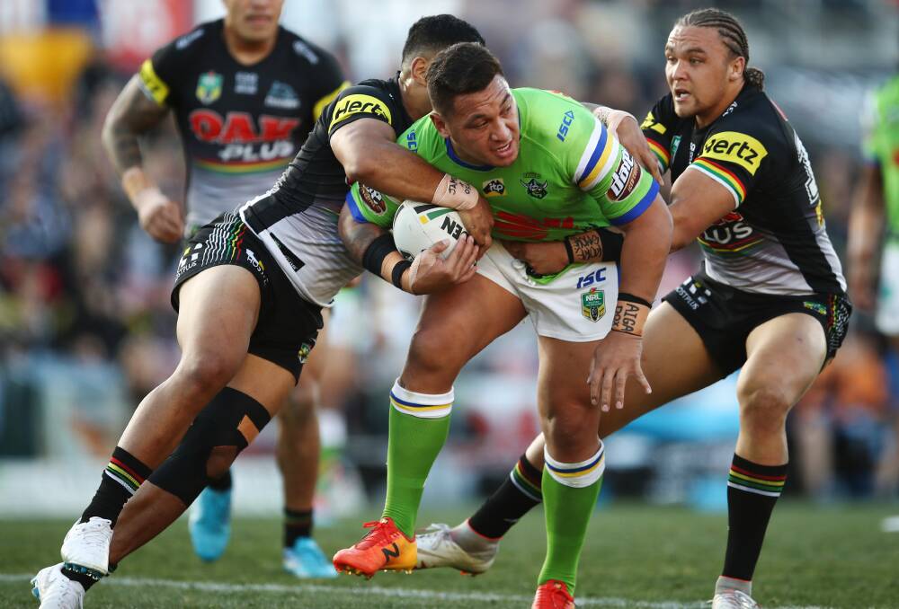 BIG CLASH: Canberra's Josh Papalii tries to bust the Penrith defence during a 2018 game between the two teams. Picture: AAP